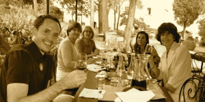 A Beyond Ordinary Travel group enjoying wine with cheese and meats